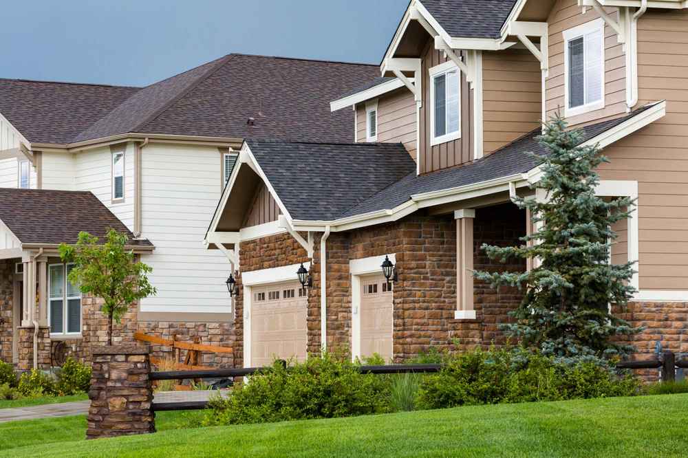 Close-up view of asphalt shingle roofing installation on a residential home